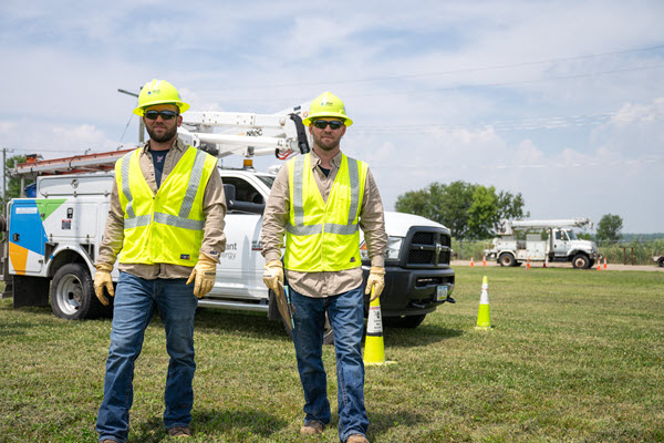 employees in front of a truck