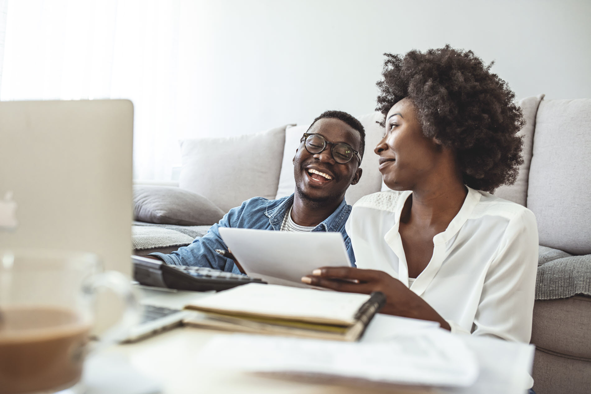 couple talking as they pay bills