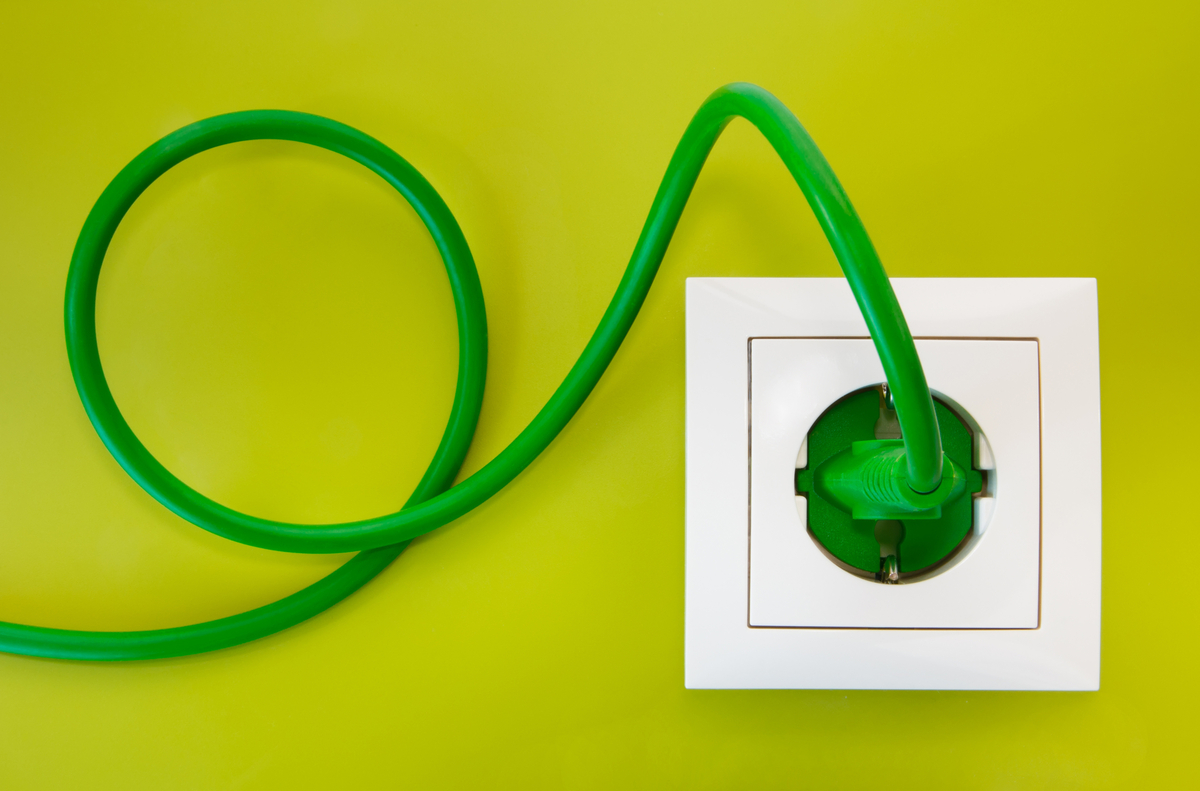 Cord and plug plugged into a wall outlet. 